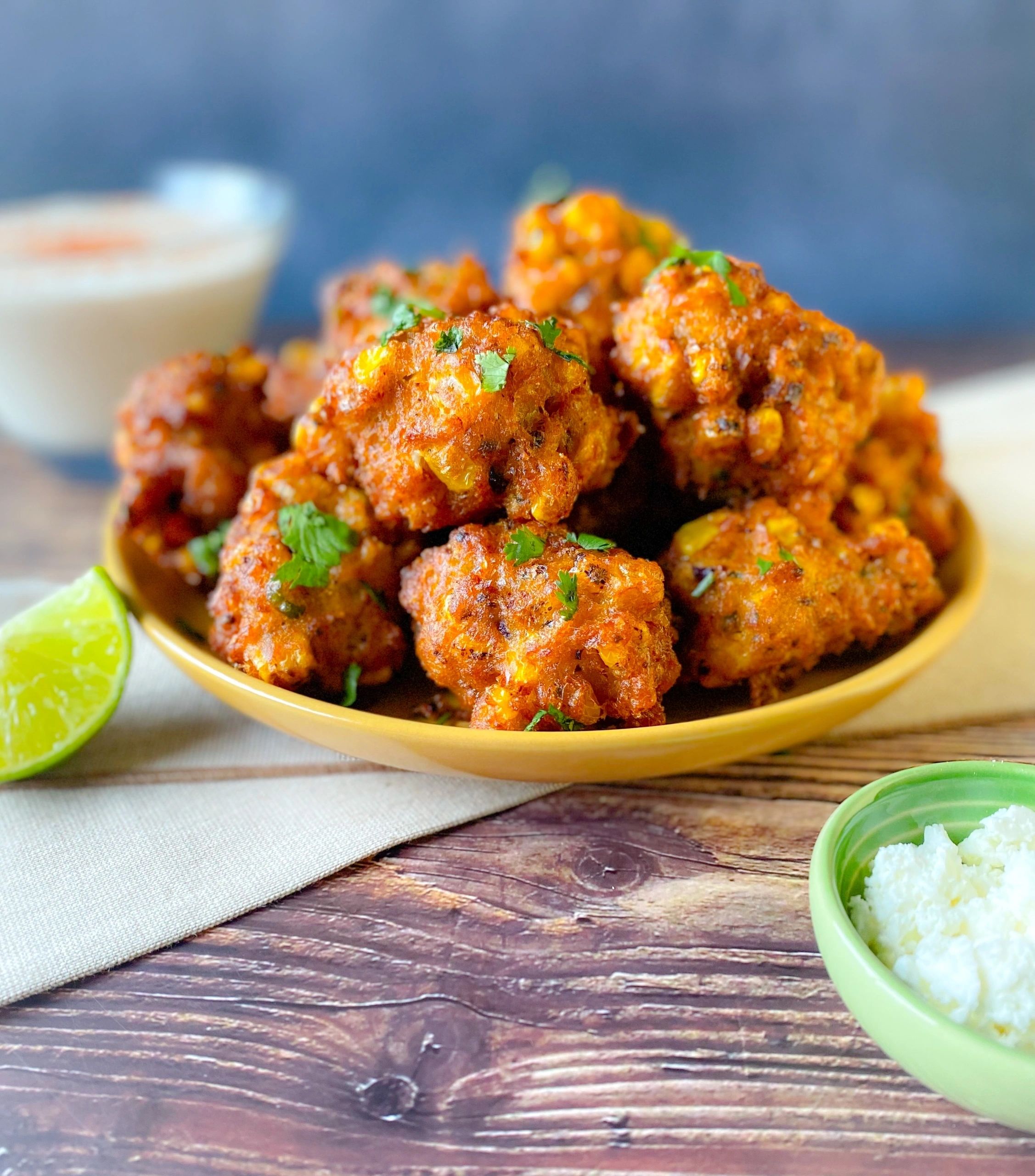 Mexican Street Corn Fritters with Zesty Lime Crema